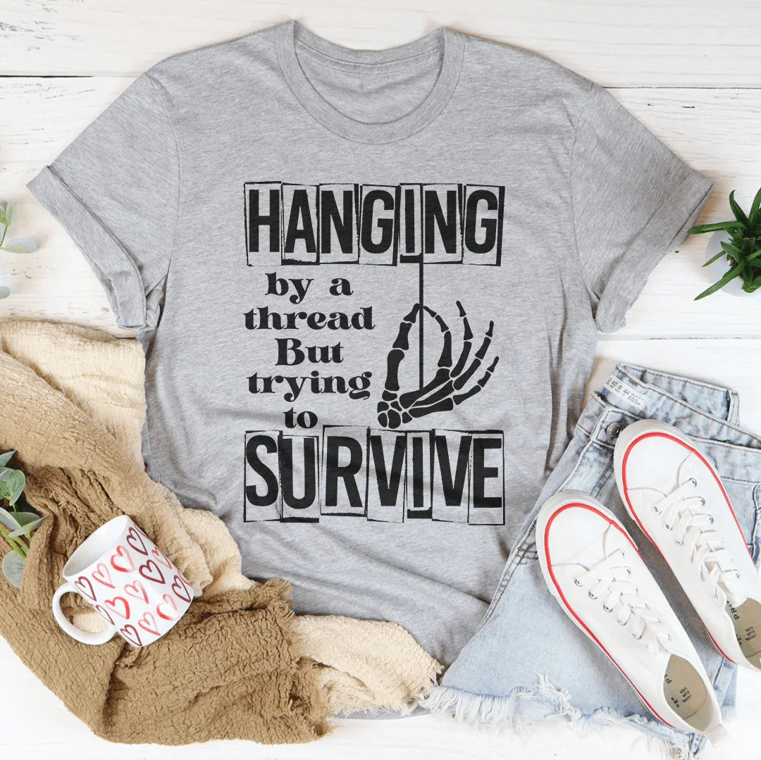 Hanging By A Thread But Trying To Survive Tee - WonderingCloth